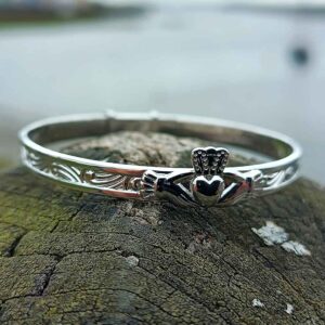 Claddagh Christening Bangle, handmade in hallmarked sterling silver. Irish new baby Christening gift with traditional Celtic Claddagh design, presented in a complimentary jewellers box, with optional gift wrapping and tracked delivery from Ireland.