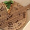 Fun Romantic Personalised Pizza Board with your Two Names in the centre of 8 Romantic "Dare" Actions. 12 inch Oak Pizza Board with Handle & Jute Rope hanger.