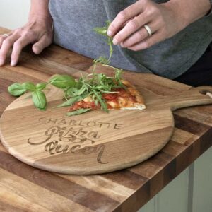 Personalised Pizza Board with Name Laser Engraved above the words Pizza Queen. Pizza Queen 12inch Oak Pizza Board with Handle & Jute Rope loop hanger.