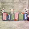 Easter Shelf Sitter Sign. Colourful Bunny Spring Farmhouse Sign Handmade In Ireland with three charming Easter Bunnies.