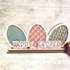 Wooden Easter Eggs Decor Shelf Sitter handmade in Ireland. Easter Home Decoration with Painted Eggs and Happy Easter in stylish colours.