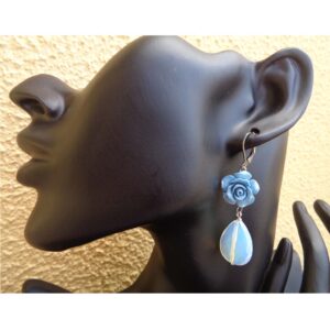 Discover handmade Blue Rose Teardrop Earrings with opal-look shimmering drops and carved floral detail. Romantic, lightweight and perfect as a gift for her.