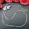 Handmade Miyuki bead eyeglass chain with tulip accents. Lightweight, elegant, and stylish – the perfect accessory to keep your glasses secure.