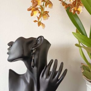 Discover Black Rose Teardrop Earrings with carved roses and glossy drops. Handmade gothic statement jewellery that’s bold, elegant and unforgettable.