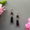 Discover Black Rose Teardrop Earrings with carved roses and glossy drops. Handmade gothic statement jewellery that’s bold, elegant and unforgettable.