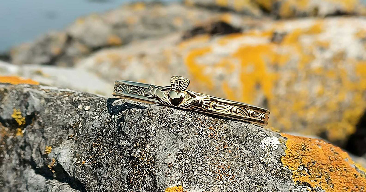 Handcrafted gold-plated Claddagh baby bangle, perfect for newborns, Christening or new baby gifts. Ships with tracked delivery and optional gift box & wrapping from Irish family jewellers.