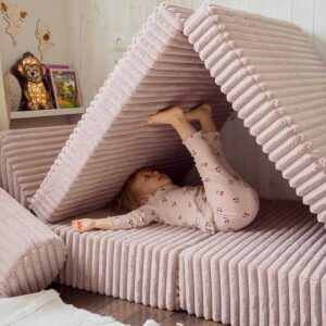 Light Pink Modular Waffle Corduroy Play Sofa for kids. Handmade 10-part design, durable & cosy for playrooms & nurseries. Delivered in Ireland & EU.