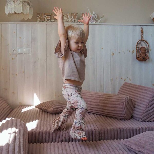 Light Pink Modular Waffle Corduroy Play Sofa for kids. Handmade 10-part design, durable & cosy for playrooms & nurseries. Delivered in Ireland & EU.