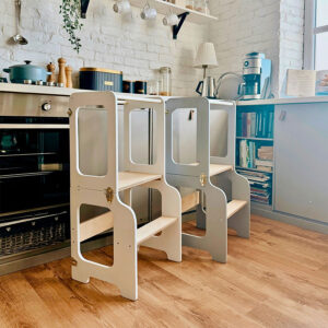 Montessori-inspired 4-in-1 kitchen helper tower with slide, table, chair and blackboard, available in multiple colours with tracked delivery across Ireland and the EU