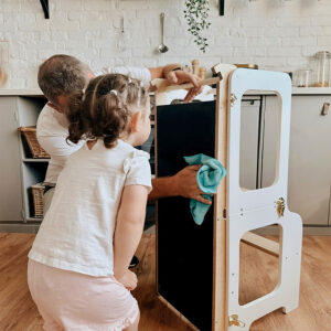 Montessori-inspired 4-in-1 kitchen helper tower with slide, table, chair and blackboard, available in multiple colours with tracked delivery across Ireland and the EU