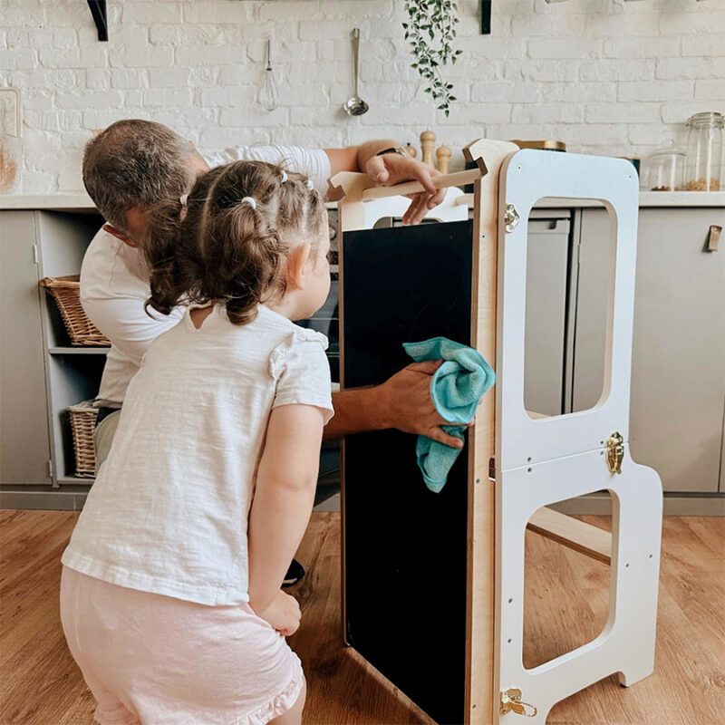 Montessori-inspired 4-in-1 kitchen helper tower with slide, table, chair and blackboard, available in multiple colours with tracked delivery across Ireland and the EU