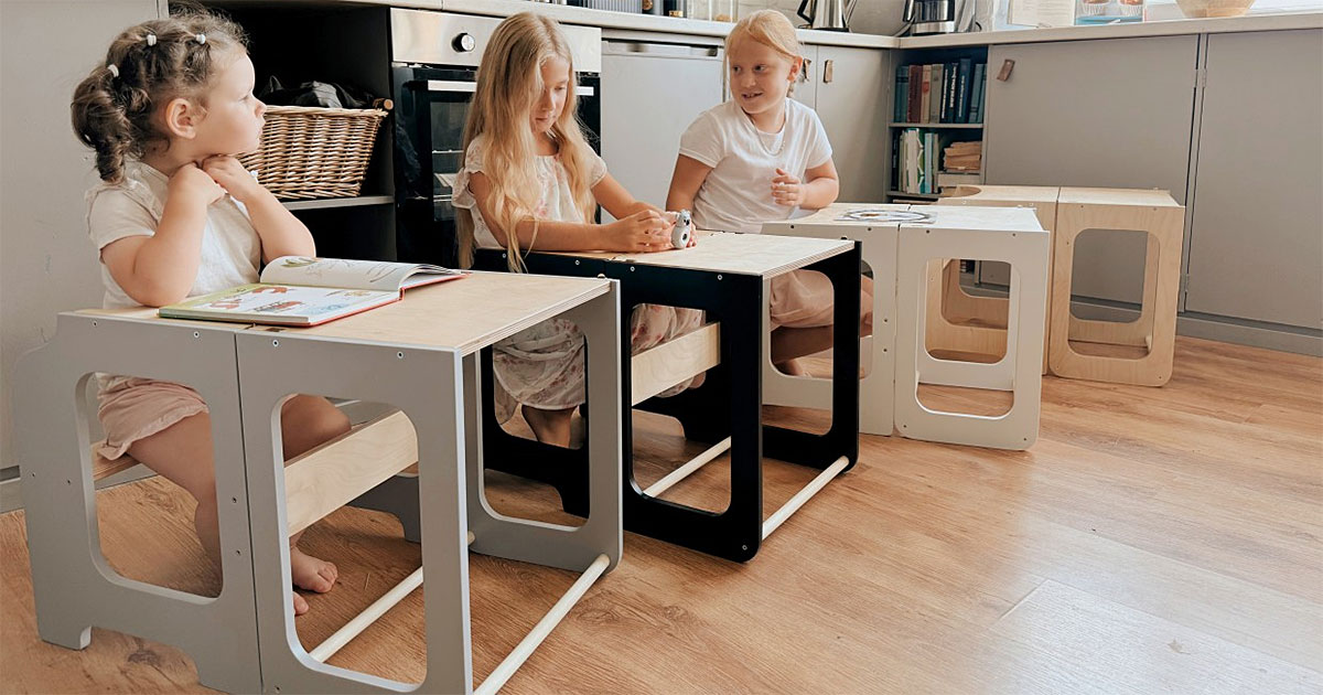 Montessori-inspired 4-in-1 kitchen helper tower with slide, table, chair and blackboard, available in multiple colours with tracked delivery across Ireland and the EU