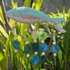 Handmade aqua fish driftwood windchime with capiz shell drops creating a soft coastal breeze sound. Coastal aqua driftwood windchime for relaxed garden spaces in Ireland.