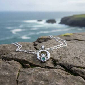 Sterling silver Claddagh pendant with emerald CZ, hallmarked in Dublin. A meaningful Irish Galway gift symbolising love, loyalty & friendship – ideal for communion, confirmation & birthdays.